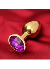 Золотистая анальная пробка с фиолетовым кристаллом - Сима-Ленд - купить с доставкой в Иваново